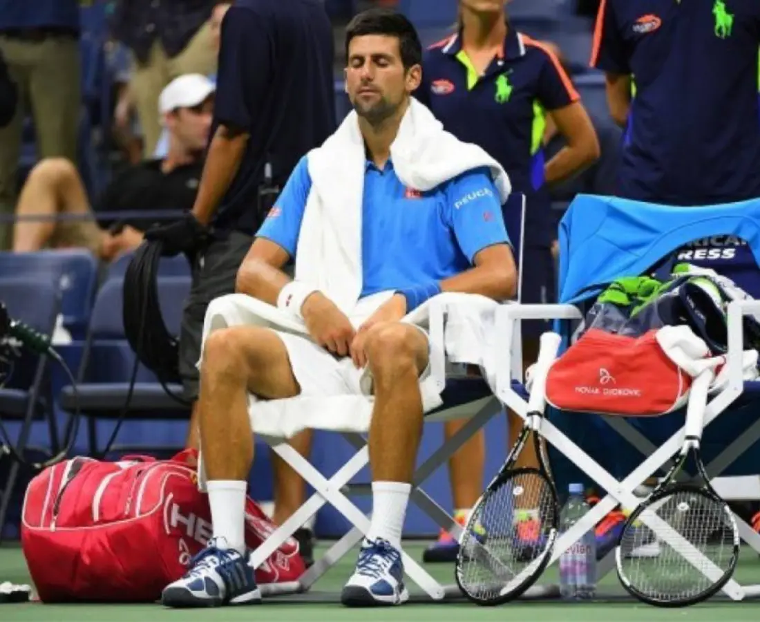 Novak Djokovic breathing courtside between points
